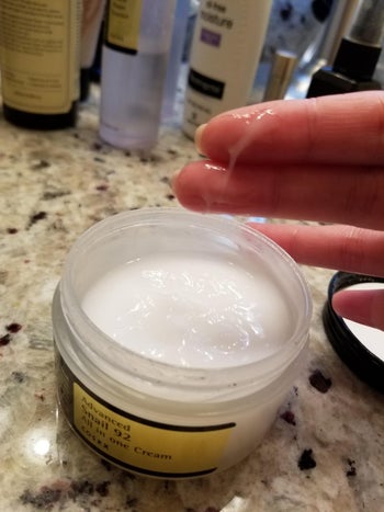 reviewer showing consistency of Cosrx snail moisturizer
