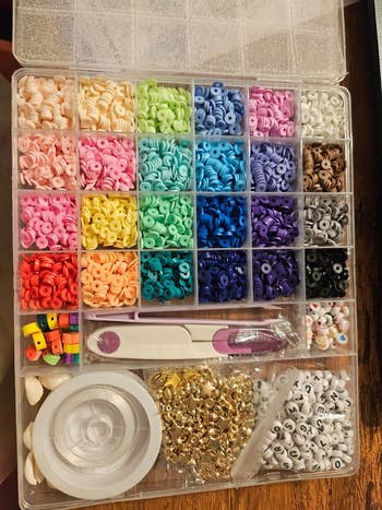Bead kit with assorted colorful beads, strings, and tools