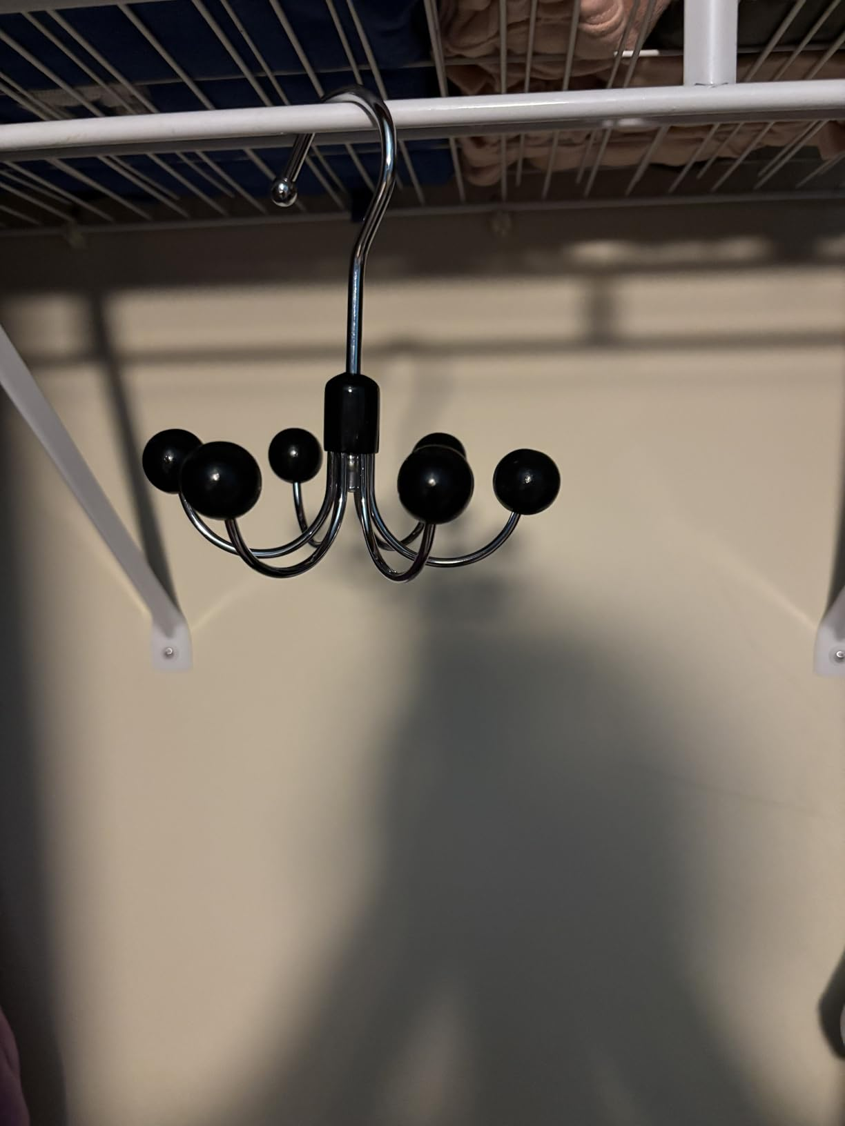 Metal apparel  hanger with hooks hanging connected  a closet rod