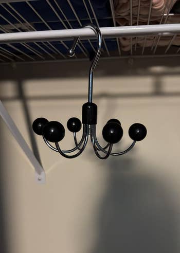 Metal apparel hanger with hooks hanging connected a closet rod