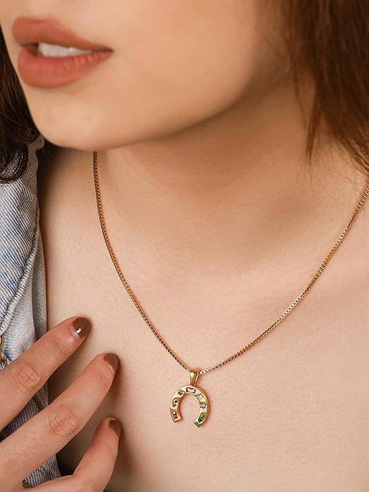 A necklace with a horseshoe pendant 