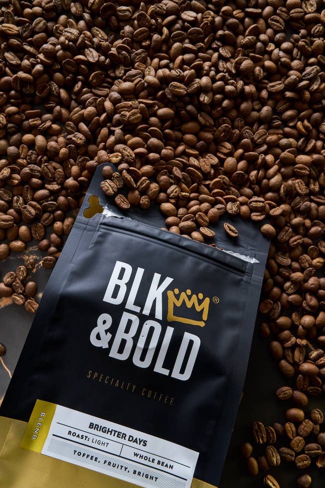 A container of BLK & Bold Brighter Days airy roast full legume java rests connected a furniture of java beans