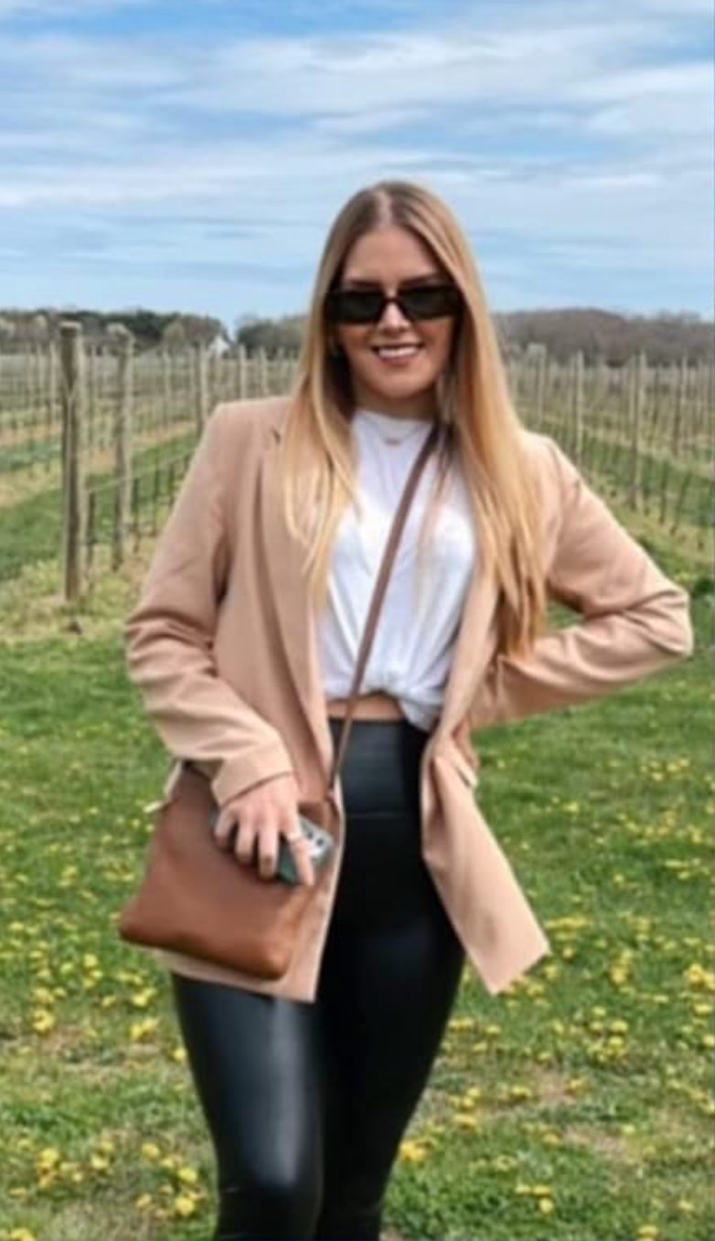 a reviewer wearing the beige blazer
