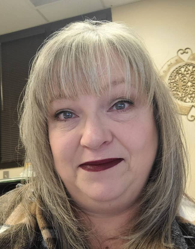A reviewer wearing the lipstick in the shade Voyager