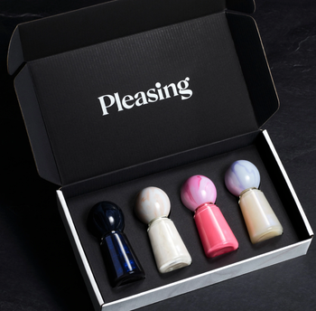 four bottles of pleasing nail polish in a box