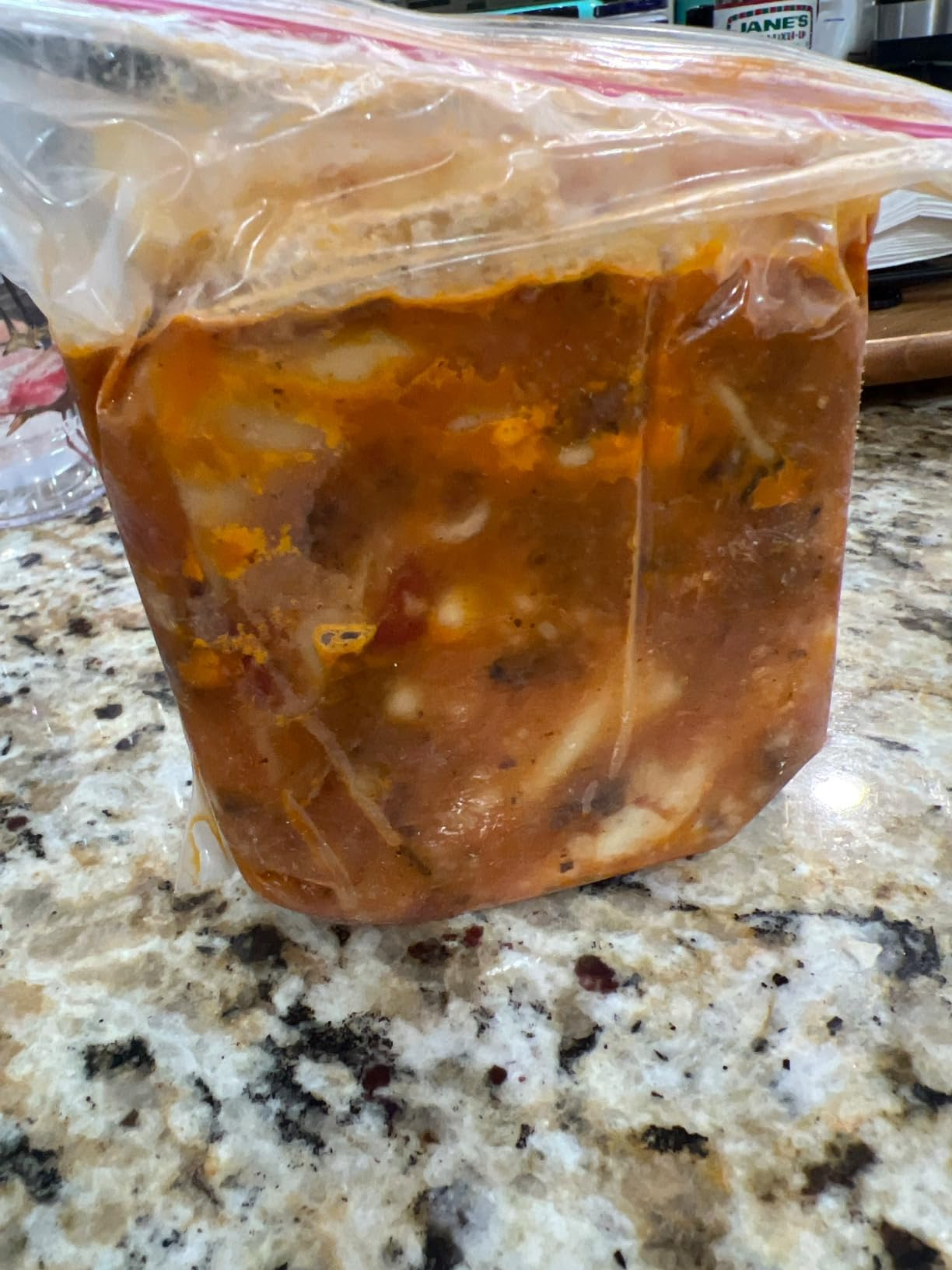 A wide   integrative  container  filled with chunky homemade crockery   placed connected  a room  countertop