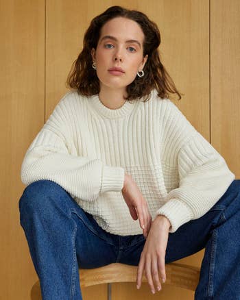 model wearing the sweater in white