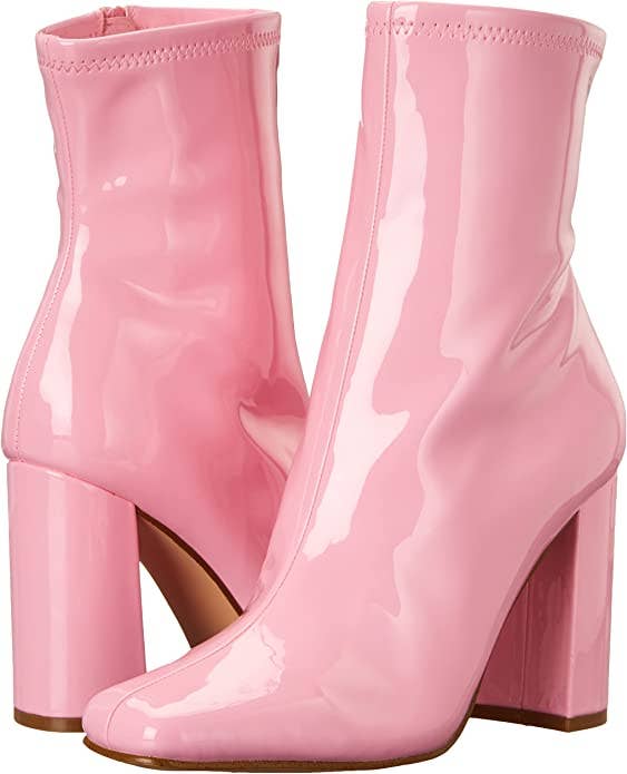 a pair of pink glossy boots