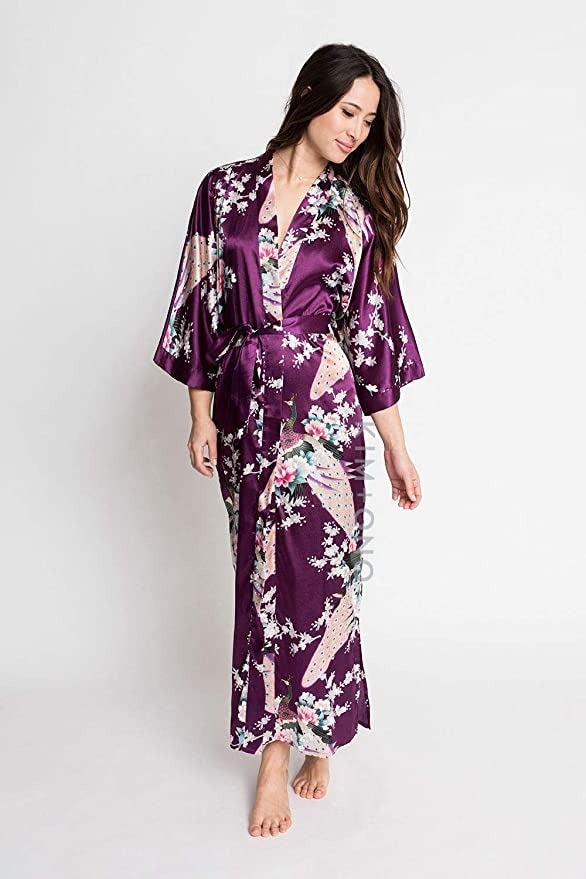 a model wearing the plum robe