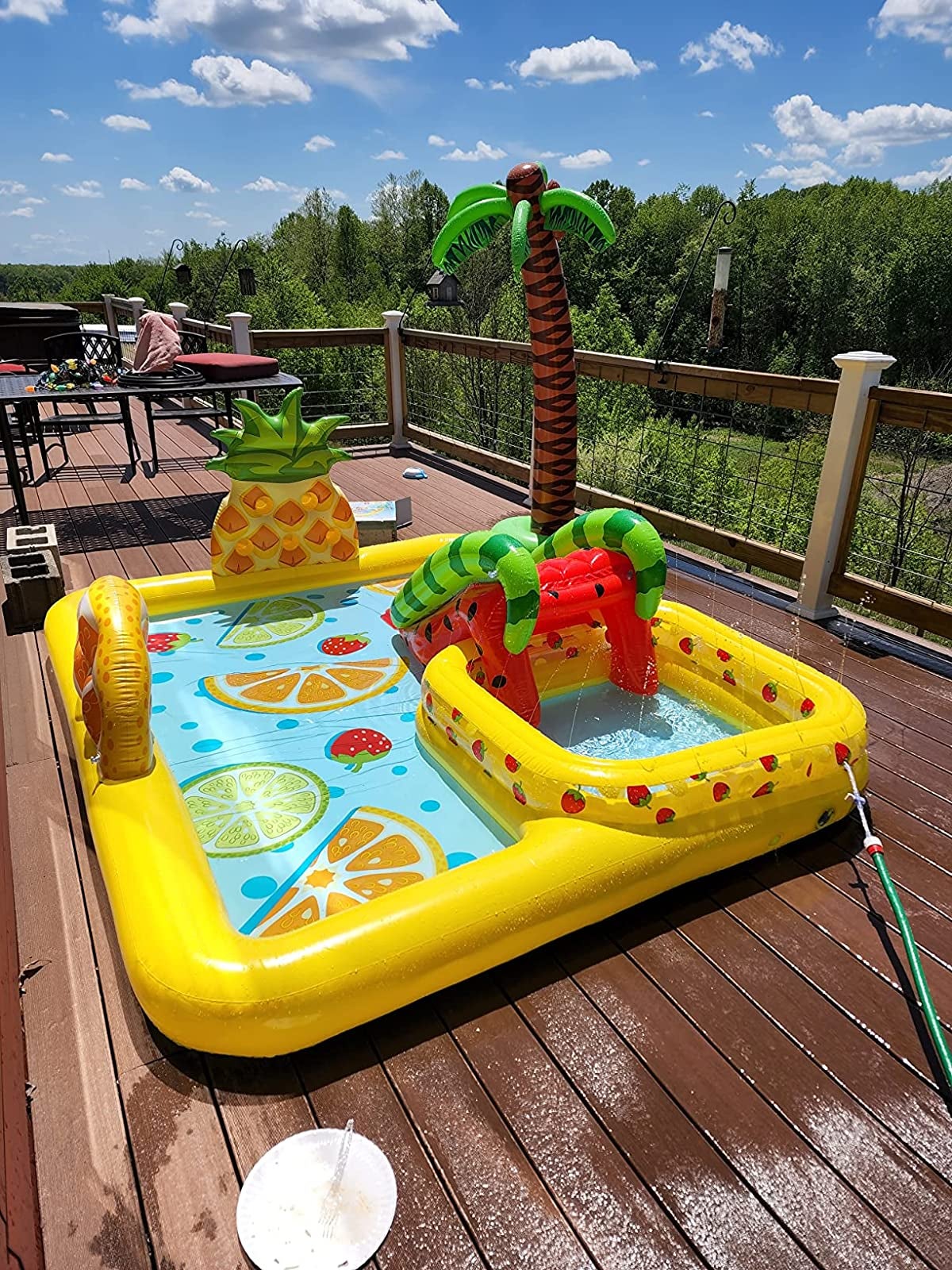 The pool center inflated on a reviewer's deck filled with water