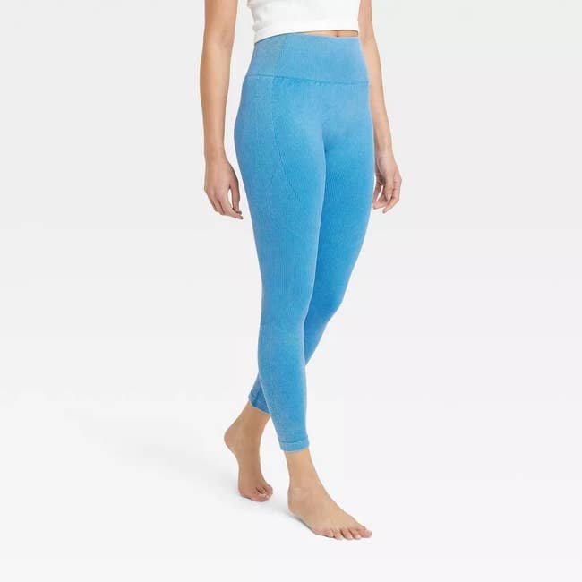 model wearing the leggings in blue