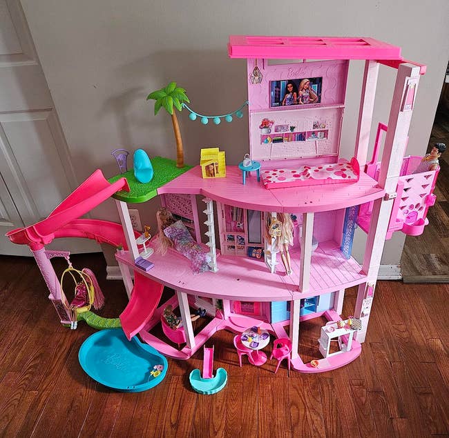 a pink massive barbie dreamhouse