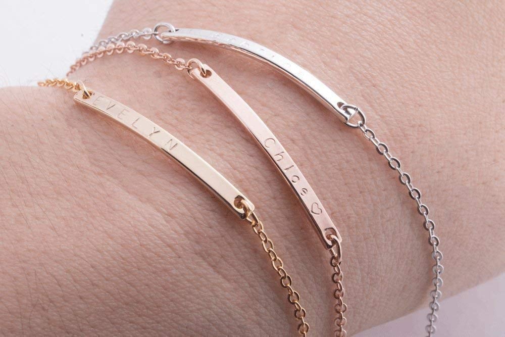 person wearing the bracelets in silver, rose gold, and gold