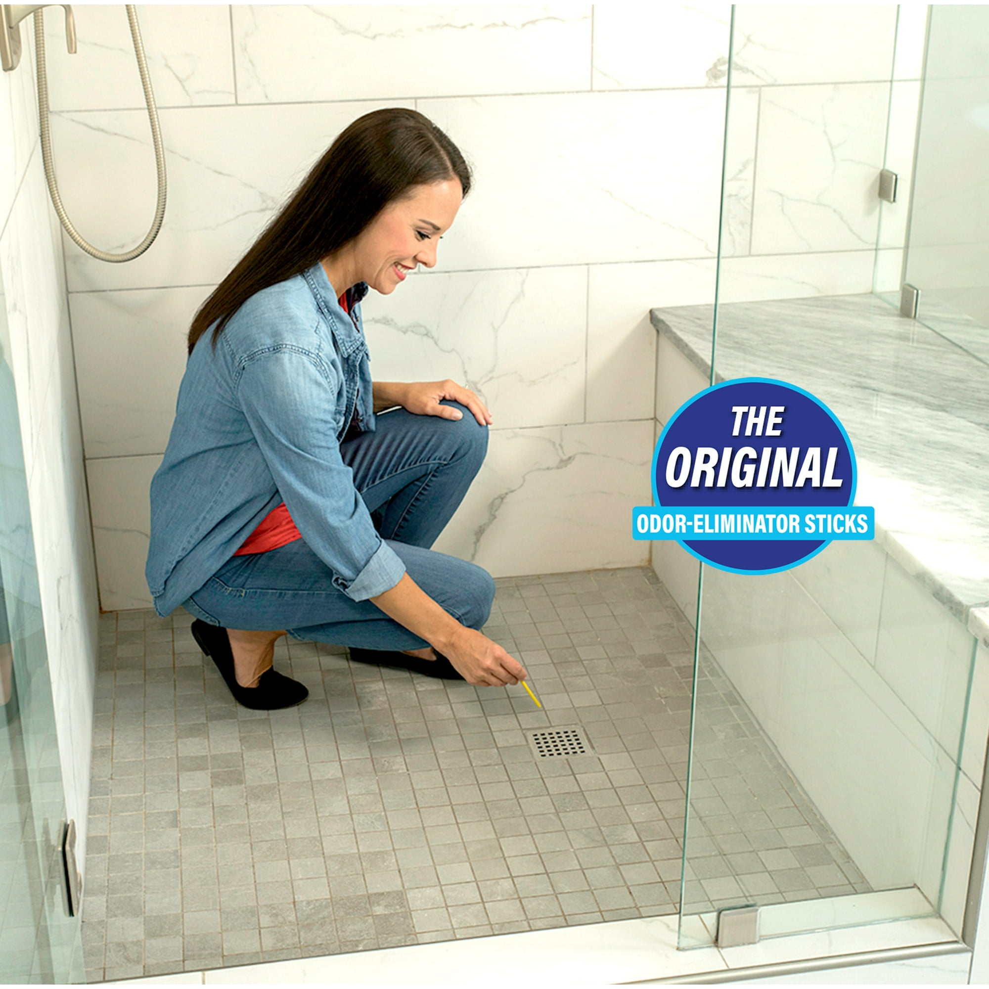 A idiosyncratic   applies an odor-eliminator instrumentality   to a ablution  drain, showcasing a cleaning product's usage  successful  a bath  setting