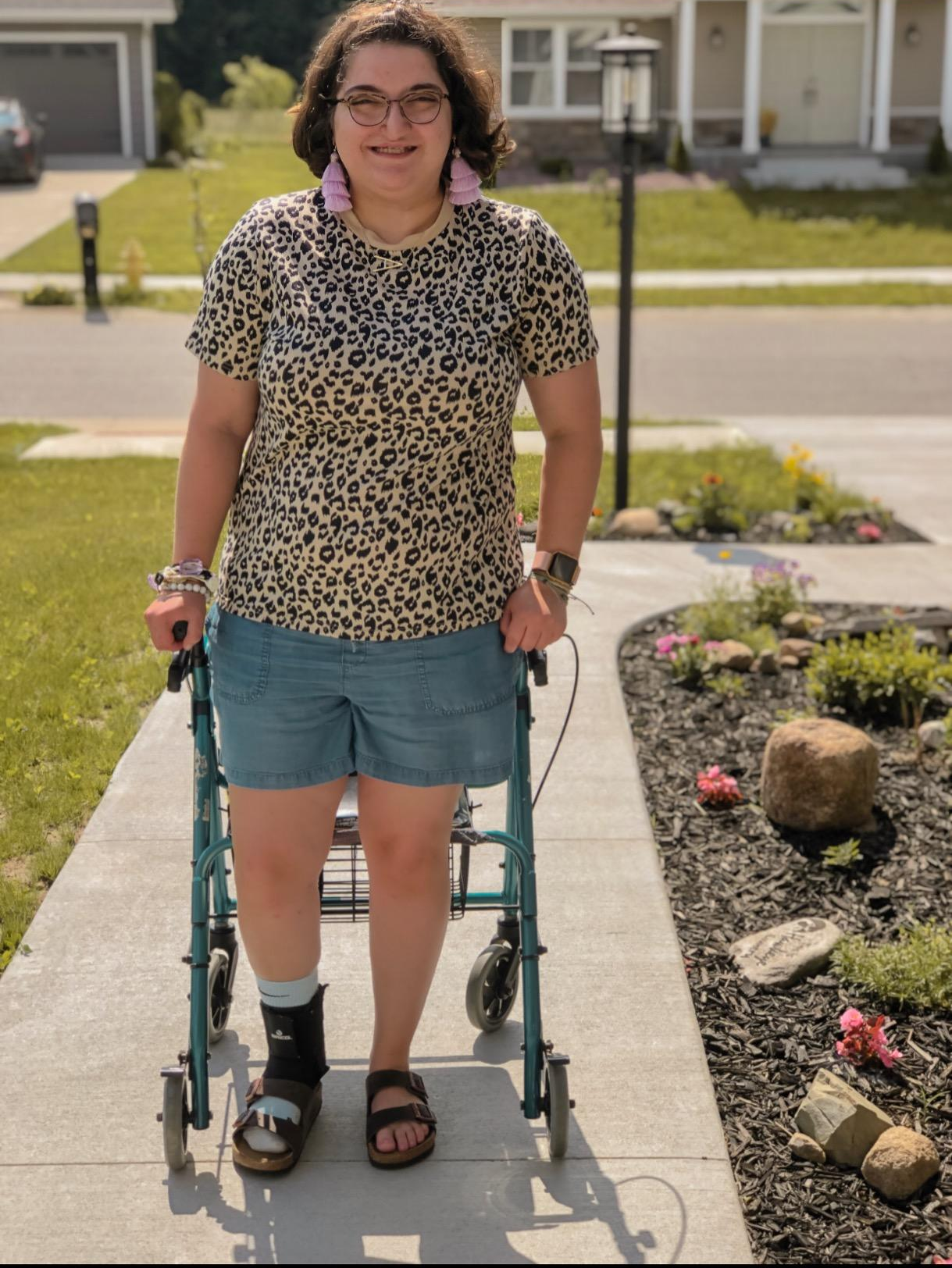 a reviewer wearing the top with shorts