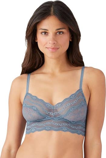 a model wearing the bralette in blue