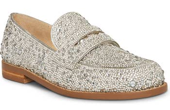 A close up of the rhinestone encrusted loafer in silver 
