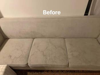 before of a couch covered in stains