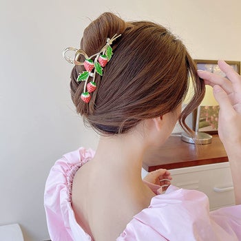 model wearing a strawberry claw clip