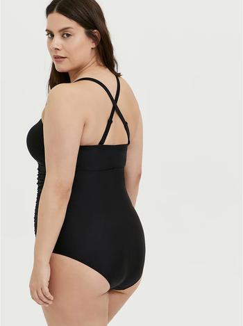 Model showing criss cross straps in back and full coverage bottom 