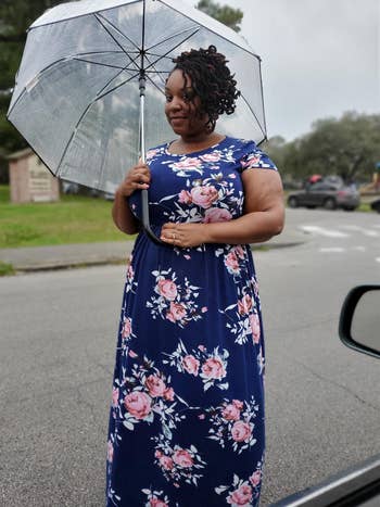 another reviewer wearing the navy floral print dress