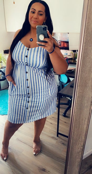 another reviewer wearing the blue striped dress