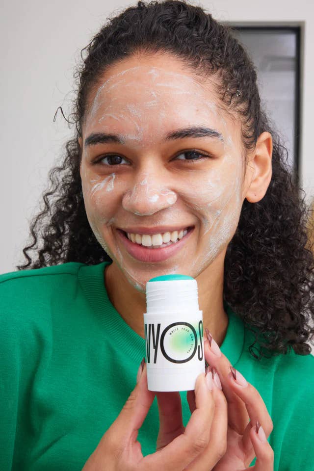 model with the solid facial cleanser stick 