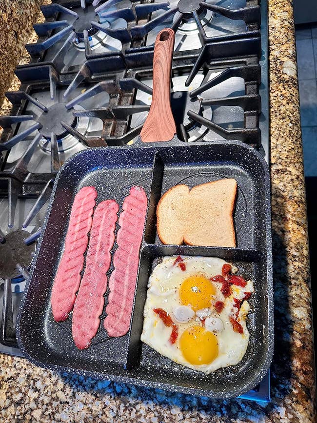 Bacon, toast, and eggs cooking unneurotic successful a divided frying cookware connected a stovetop. Suitable for a buying nonfiction astir kitchenware oregon cookware