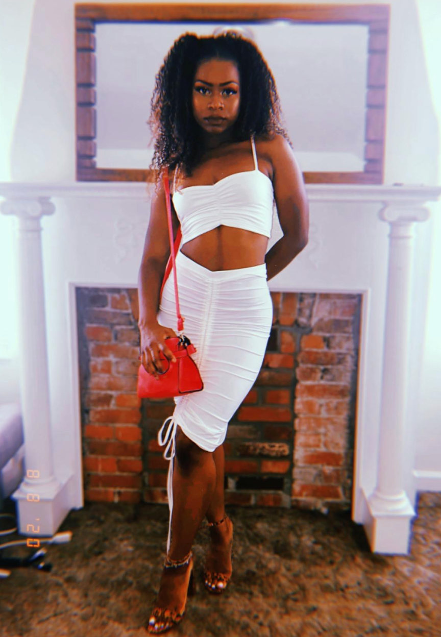 reviewer wearing the white set