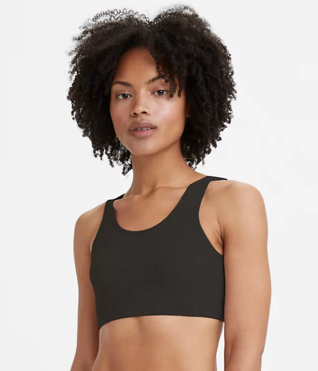 a model wearing a ribbed bralette in black