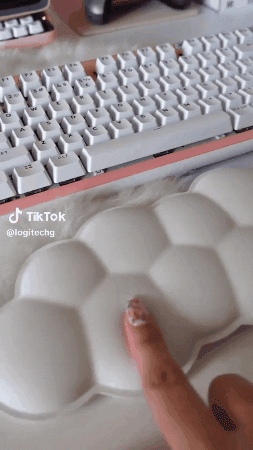 a gif of someone pressing their finger down on the cloud wrist rest