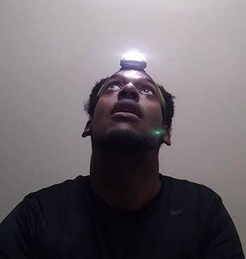 different reviewer wearing the lit headlamp