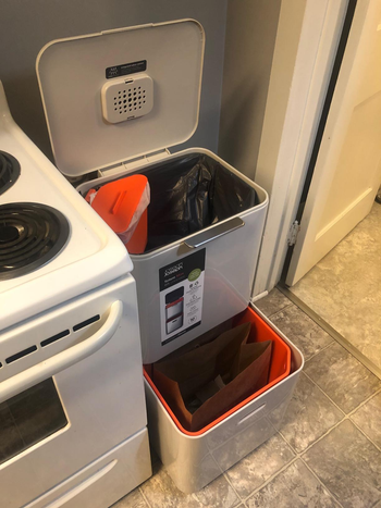 a reviewer photo of the open trash can showing the main compartment, compost bin and bottom drawer for recyclables 