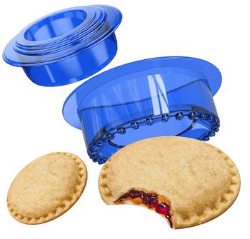 the blue sandwich cutter with two sandwiches