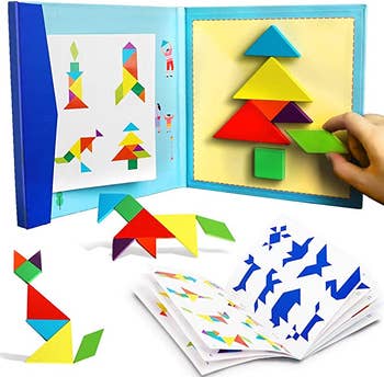 A child creating a tree using various, colorful magnetic blocks