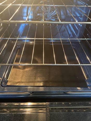 Reviewer's oven liner on the bottom of their oven