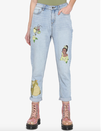 light wash mom jeans with patches of tiana, ray, and louis on them