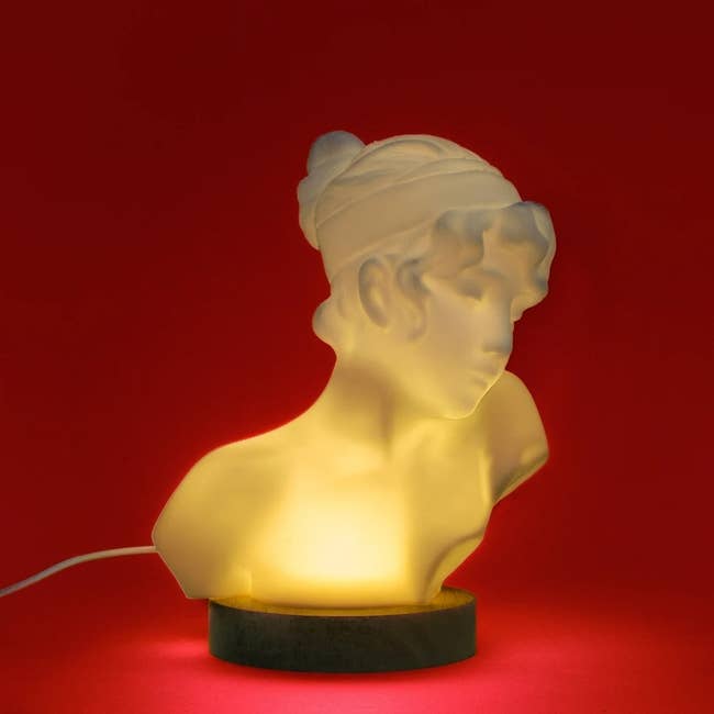glowing statue of the poet Sappho