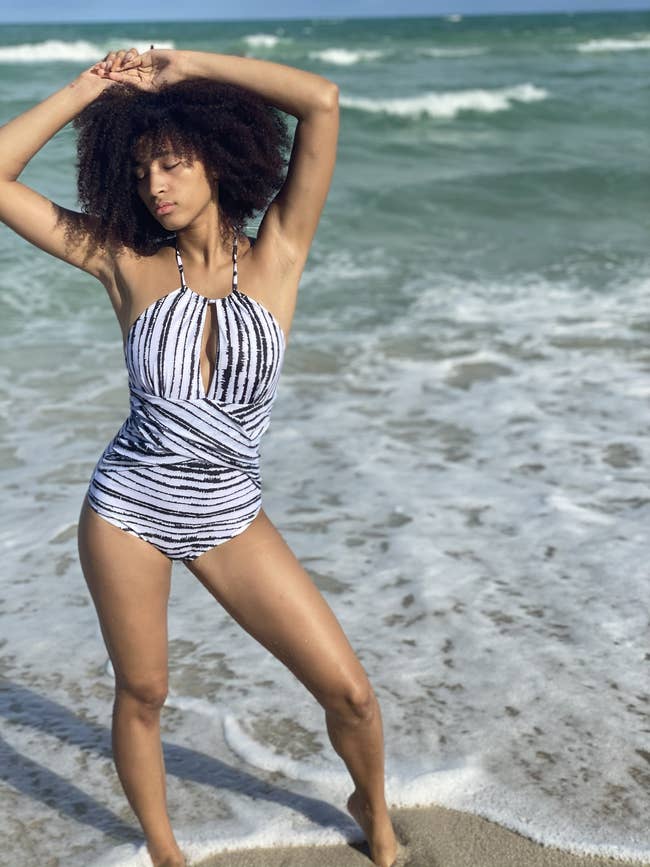 A model in the black and white striped one piece