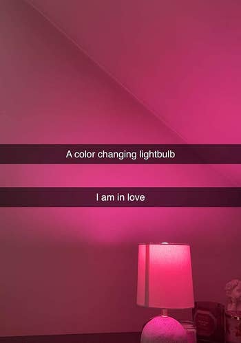 reviewer showing the light bulb in a lamp glowing pink, with their text over it saying 