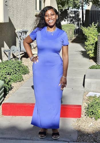 reviewer wearing the dress in blue