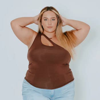 a model wearing the top in brown