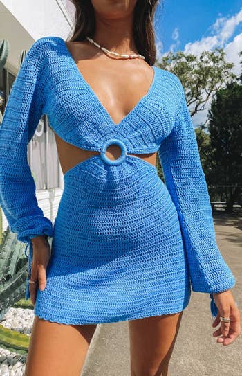 model in blue crochet dress with rib cutouts