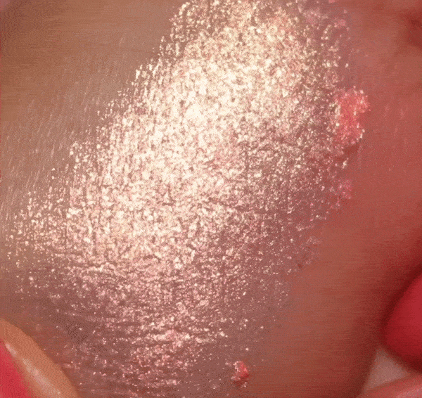 gif of a model swatching gel shadow on their skin