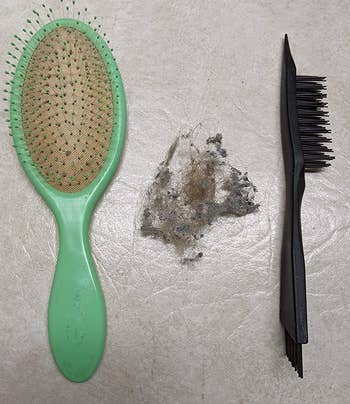 same reviewer's after photo showing their hairbrush without lint next to the cleaning brush, with a pile of lint that was removed between them
