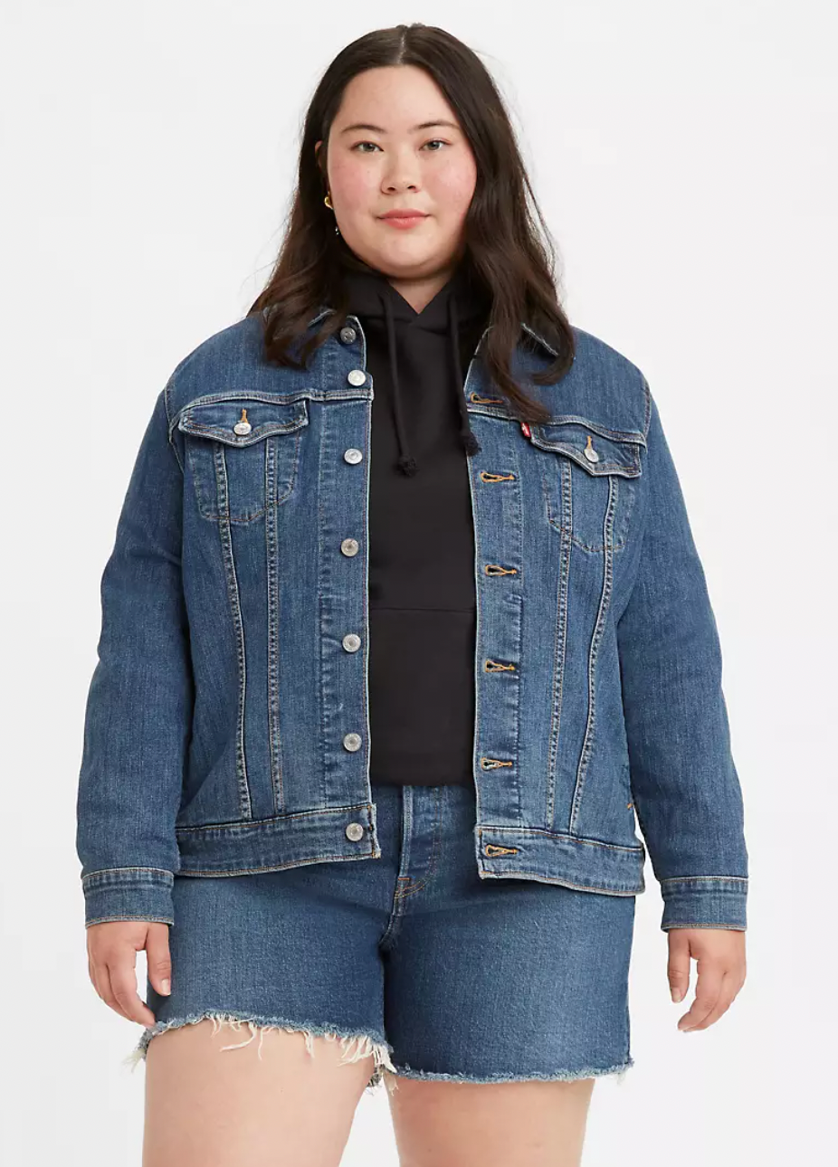 a model wearing a blue denim jacket