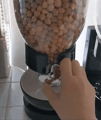 Reviewer gif of someone dispensing the cereal into a bowl