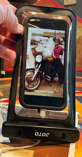 A reviewer's phone inside the case
