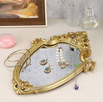 mirror being used as a trinket dish