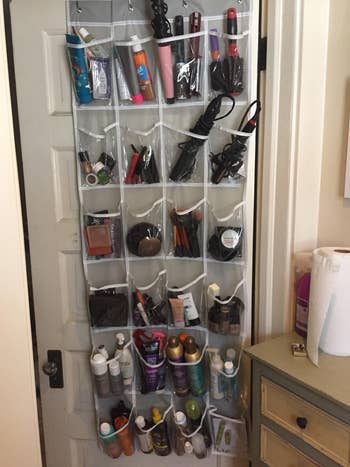 reviewer's door with 4-pocket-by-6-pocket organizer filled with hair products and tools